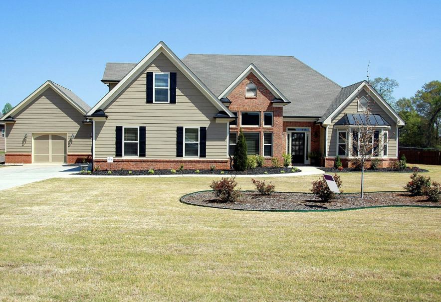 Home with a new roof by Natural Construction